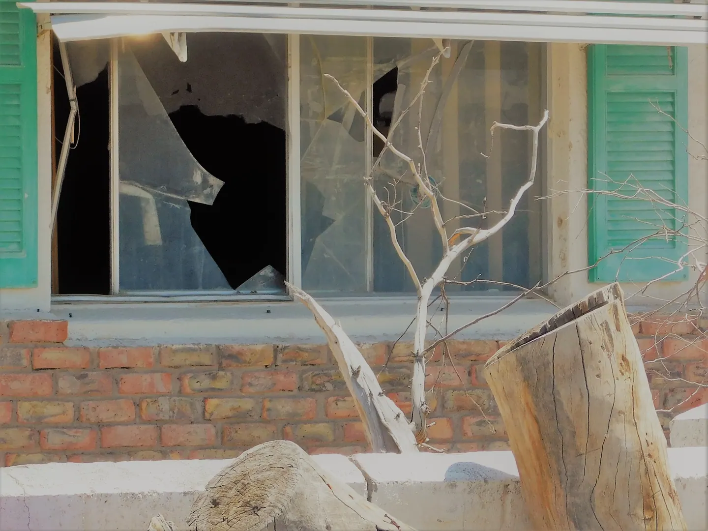 Home exterior with wind damage after a storm